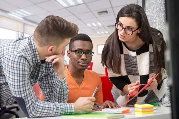 istock Multiracial contemporary business people working connected with technological devices like tablet and laptop 918704030
