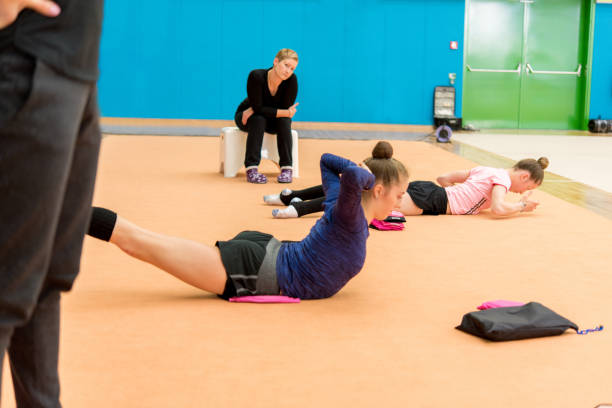 istock Late Teen Rhythmic Gymnastics Athletes Warming Up 918710222
