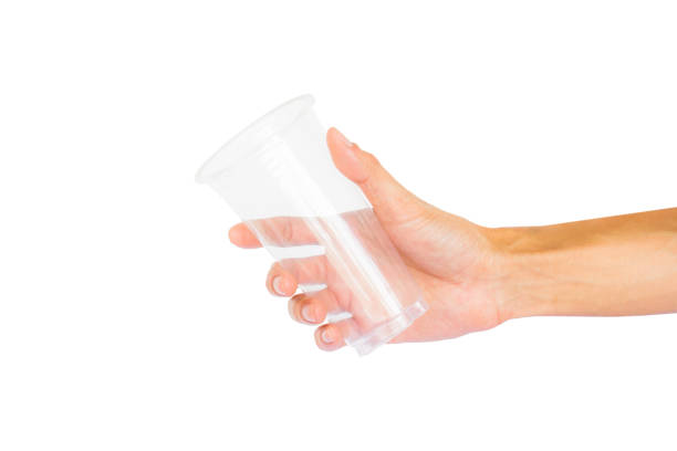istock Cropped Hand Holding Drinking Glass Against White Background 918715662