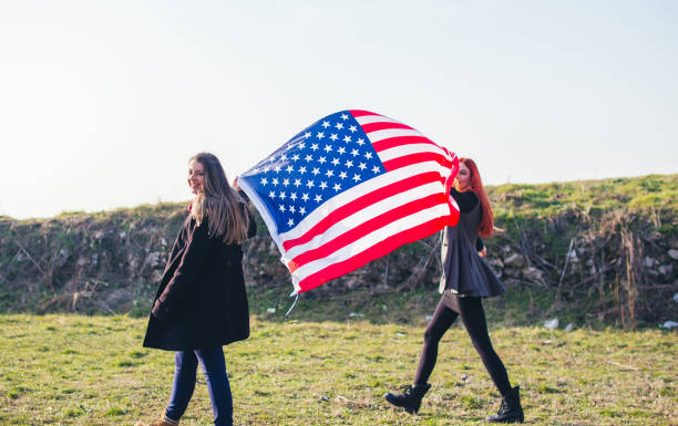 istock Two girls with USA flag. 918726952
