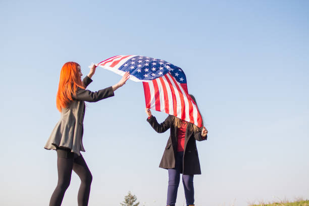 istock Two girls with USA flag. 918729008