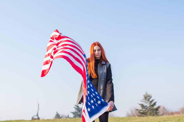 istock Happy girl with USA flag. 918729674
