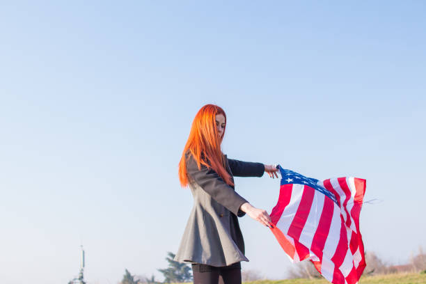istock Happy girl with USA flag. 918729744