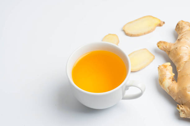 istock hot ginger tea ginger ale ginger beer in glass with ginger slice on white background 918732488
