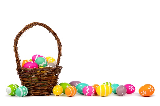 Easter basket with long border of colorful hand painted Easter Eggs over a white background