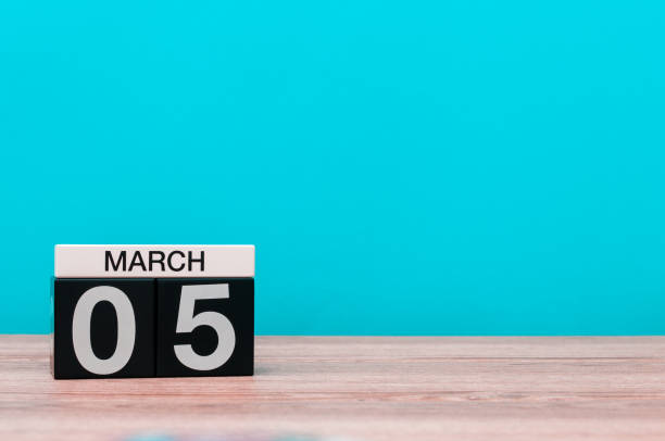 istock March 5th. Day 5 of march month, calendar on turquoise background. Spring time, empty space for text, mockup 918733062