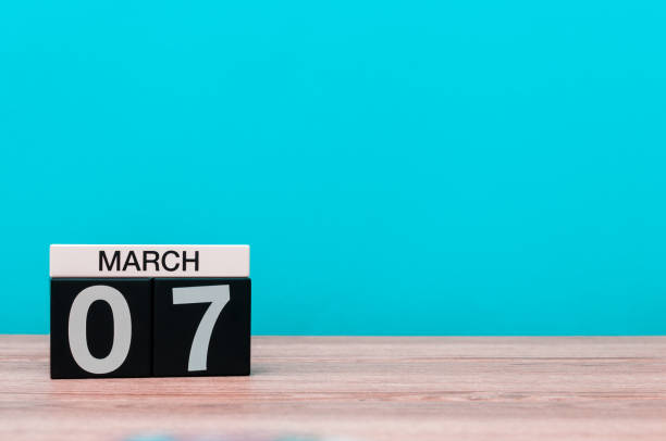 istock March 7th. Day 7 of march month, calendar on turquoise background. Spring time, empty space for text, mockup 918733100