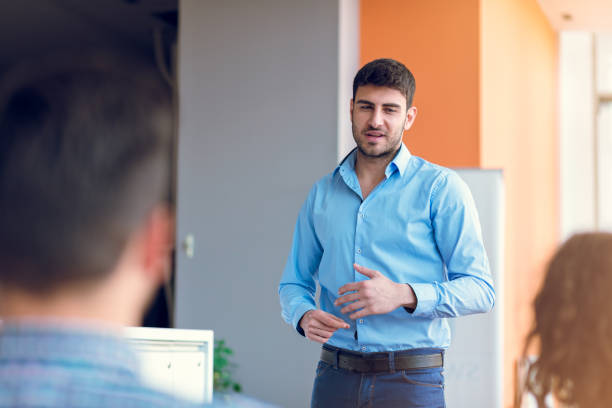 istock Group of casually dressed businesspeople discussing ideas in the office. 918737018
