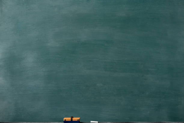 Smudged blank blackboard with board eraser and chalk Close-up of smudged blank blackboard with board eraser and chalk. board eraser photos stock pictures, royalty-free photos & images