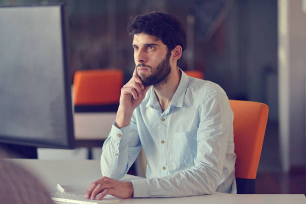 istock business, startup and people concept - businessman or creative male office worker with computer 918745892