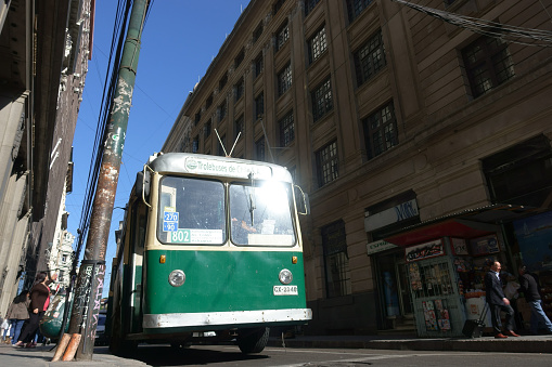 Valparaiso, Chile - January 18, 2018: the old tram runs on the city streets of Valparaiso. Old trolleybus system from 1950 's is one of the icons of Valparaiso city.