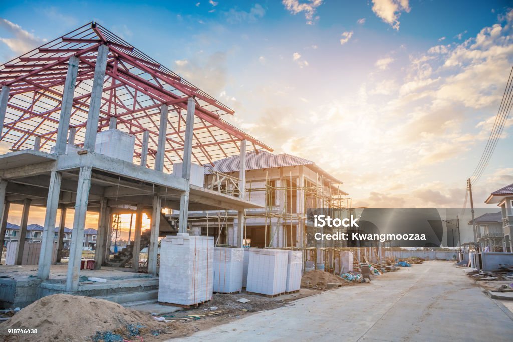 construction residential new house in progress at building site Construction Site Stock Photo