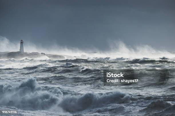 Turbulent Ocean Lighthouse Stock Photo - Download Image Now - Sea, Storm, Rough