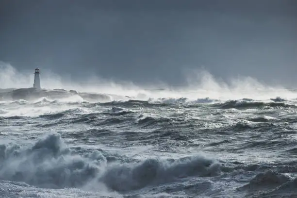 Giant waves break near the lighthouse at Peggy's Cove, Nova Scotia.