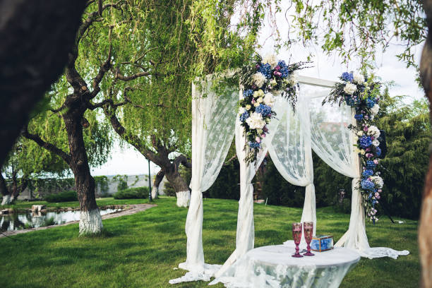istock Beautiful wedding arch and table in the nature. Wedding decorations. 918755608