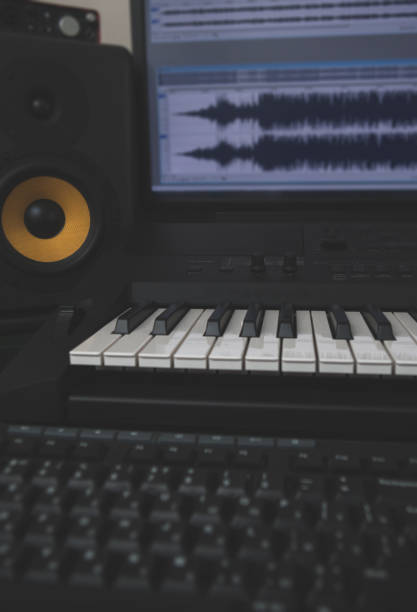 istock Home recording studio with professional monitors and midi keyboard. 918757744