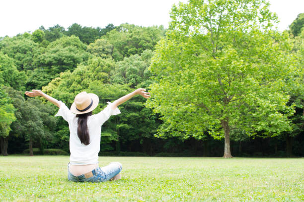 istock Woman relaxing in the park 918763348