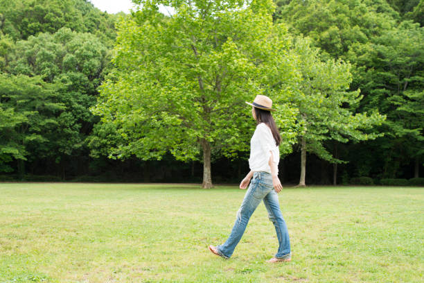 beautiful Japanese woman is relaxing in the park