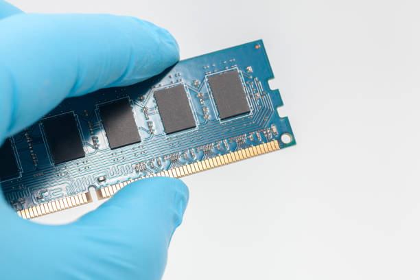 istock hand in blue glove holding ram memory on white background 918776066