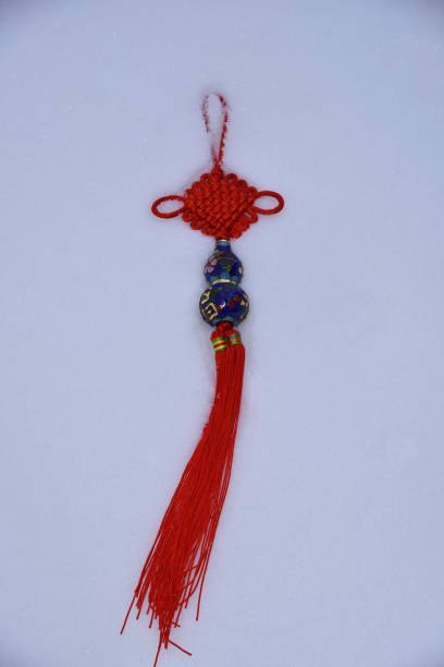 istock Bless Chinese New Year with good luck charm kept on clean fresh snow. 918779656