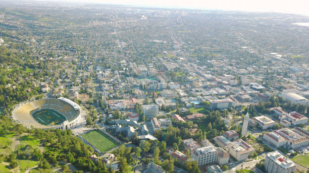 Drone Aerial over Suburban/Urban City, College Campus with Football Field UC Berkeley Aerial berkeley campus stock pictures, royalty-free photos & images