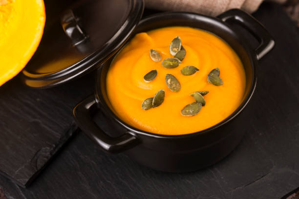 istock Pumpkin and carrot soup with seeds 918782192