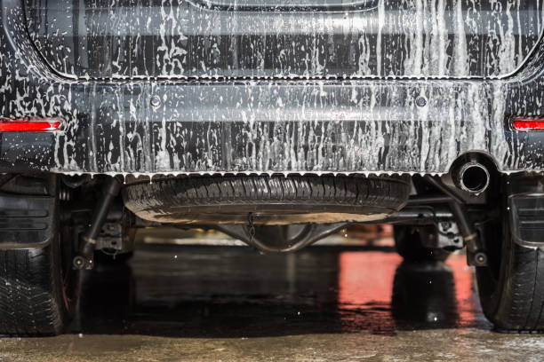istock A man using soap for car washing in car care shop 918785736