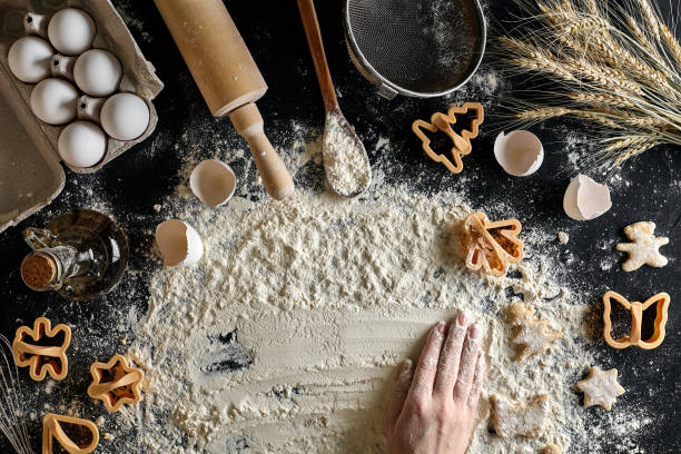 istock Top view female hands prepares a place for cooking dough 918786050