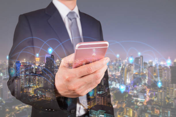 istock Double exposure of businessman use smartphone, communication 4G 5G node networking telephone cellsite andcityscape urban in the night as business, technology and telecom concept 918802186