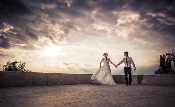 istock Happy married couple taking a walk on a terrace and communicating. 918802852