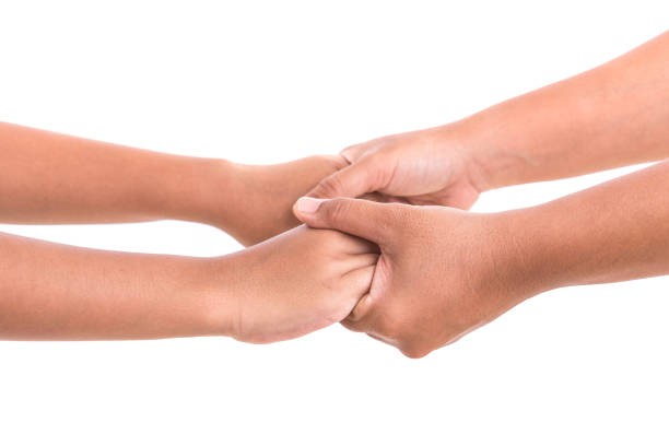 istock Mother holding her daughter hand. Help or support concept. Isolated on white 918803564