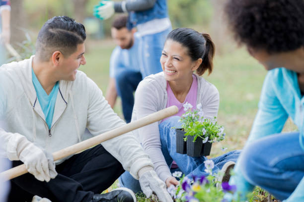 istock Two community volunteers enjoy planting together 918803580