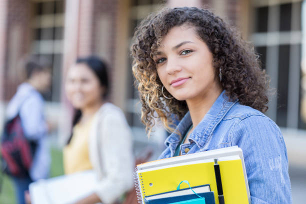 istock Confident teenage student outdoors on high school campus 918805746