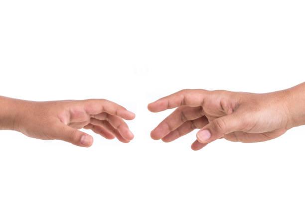 istock Two hands try to reach. Help concept. Isolated on white 918805886