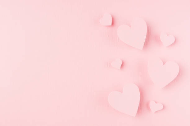 istock Valentines day background with hearts flying on pink paper, copy space. 918807264