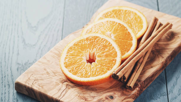 istock slices of ripe orange on olive cutting board 918809812