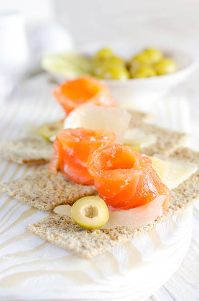 Delicious appetizer canape with salmon and cheese.