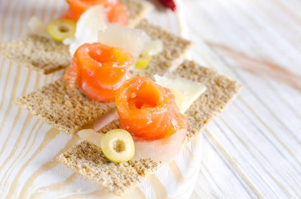Delicious appetizer canape with salmon and cheese.