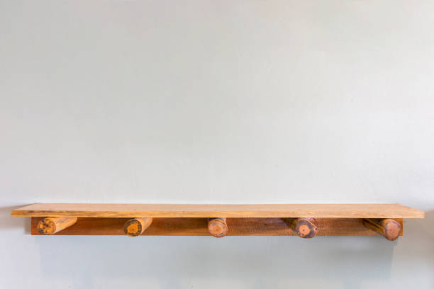 istock Empty top wooden shelves on white cement wall 918813216