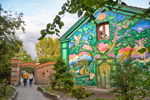 Cjpenhagen, Denmark - August 22, 2014:  The house painted by author graffiti at the entrance to Christiania in Copengagen, Denmark. Fristaden Christiania is a self-proclaimed autonomous district.