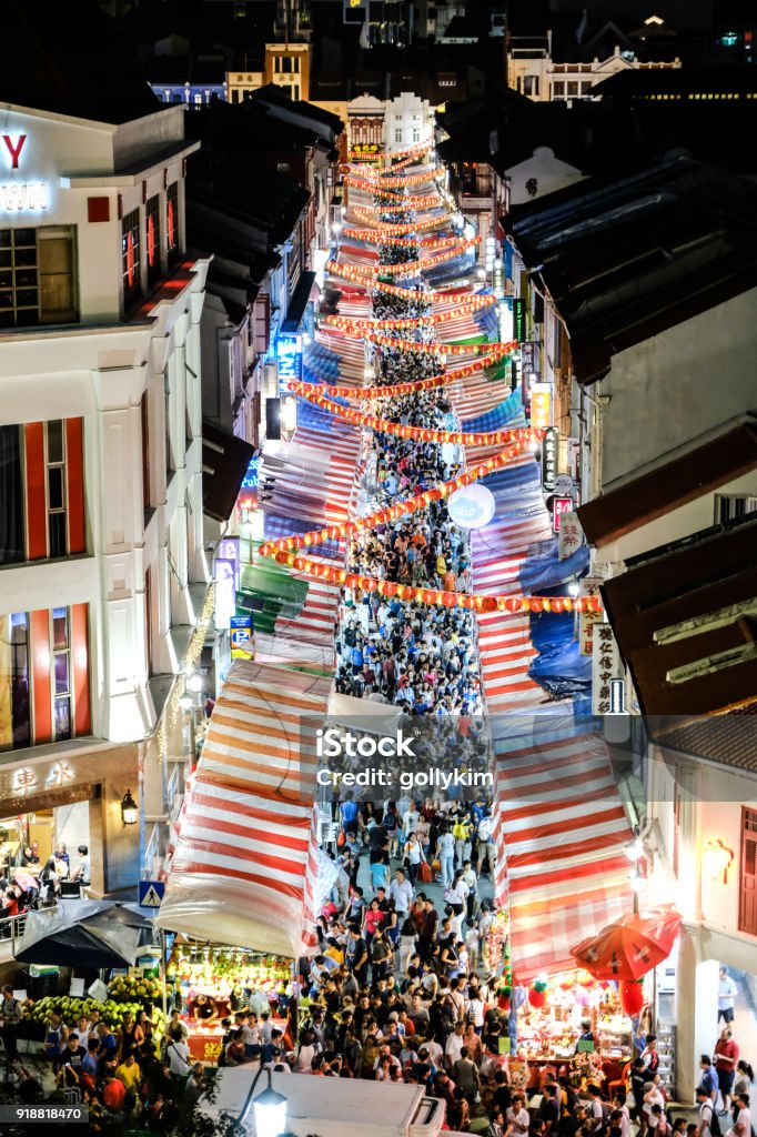 Elevated view of Singapore Chinatown night market during Chinese New Year period with packed crowd of people shopping for lunar new year goods, decorations and food for the festive celebrations Singapore Chinatown night market during Chinese New Year Singapore Stock Photo