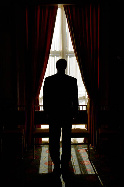 istock Silhouette of a groom in window 91882297