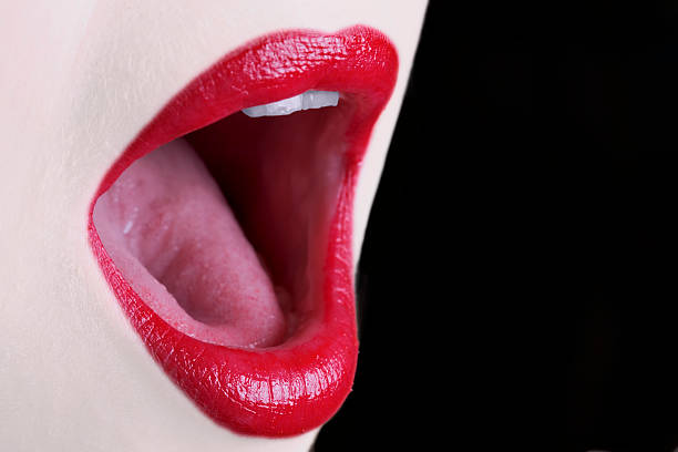 istock Close-up of red lips and open singing mouth 91882459