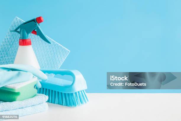 Cleaning Set For Different Surfaces In Kitchen Bathroom And Other Rooms Empty Place For Text Or Logo On Blue Background Cleaning Service Concept Early Spring Regular Clean Up Front View Stock Photo - Download Image Now