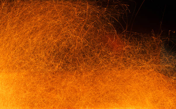 istock Sparks of fire on a black . Abstract  background with fire sparks. 918829252