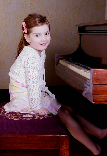 istock Preschooler at piano 91883604