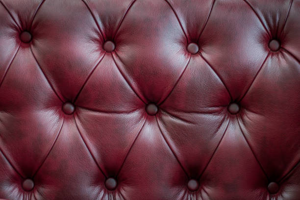 istock Closeup texture of vintage red leather sofa for background 918838716