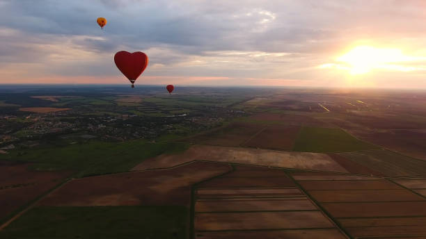 istock Hot air balloons in the sky over a field 918842212