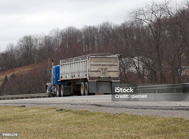 Dump Truck On The Highway Stock Photo - Download Image Now - Truck, Exchanging, Garbage