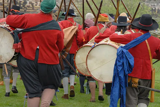 Musketeers and drummers marching to war